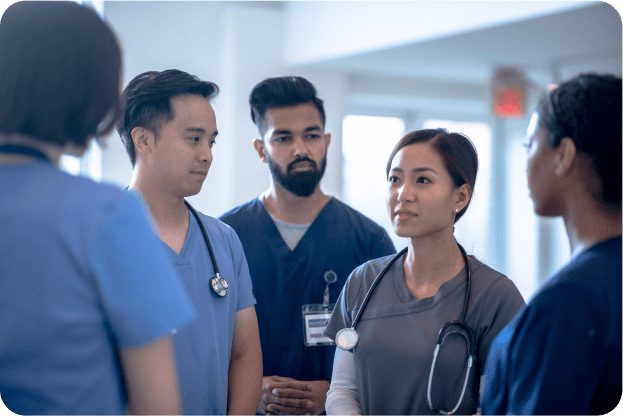 LotusOne Services image of a group of nurses talking