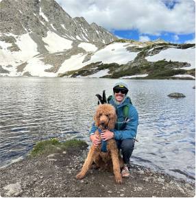 Aya clinician at a lake with a dog