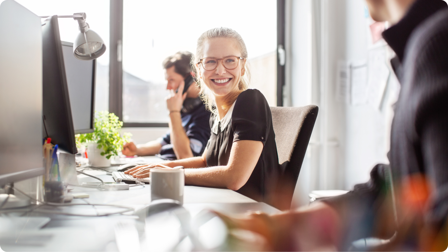 Woman at desk smiling