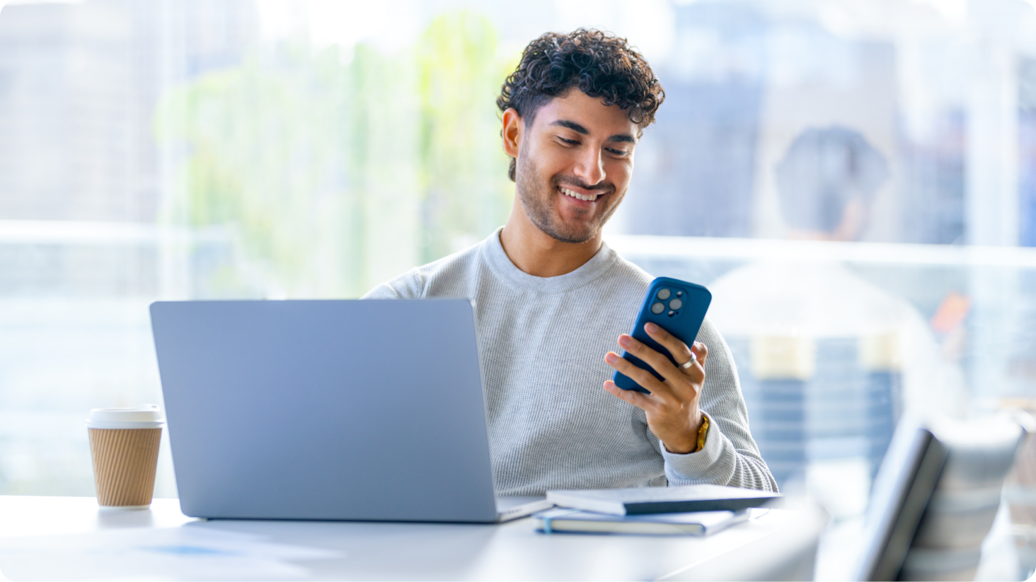 Man on phone and laptop