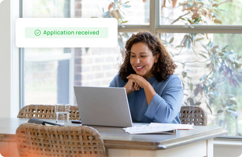 Woman crossed arms in front of laptop